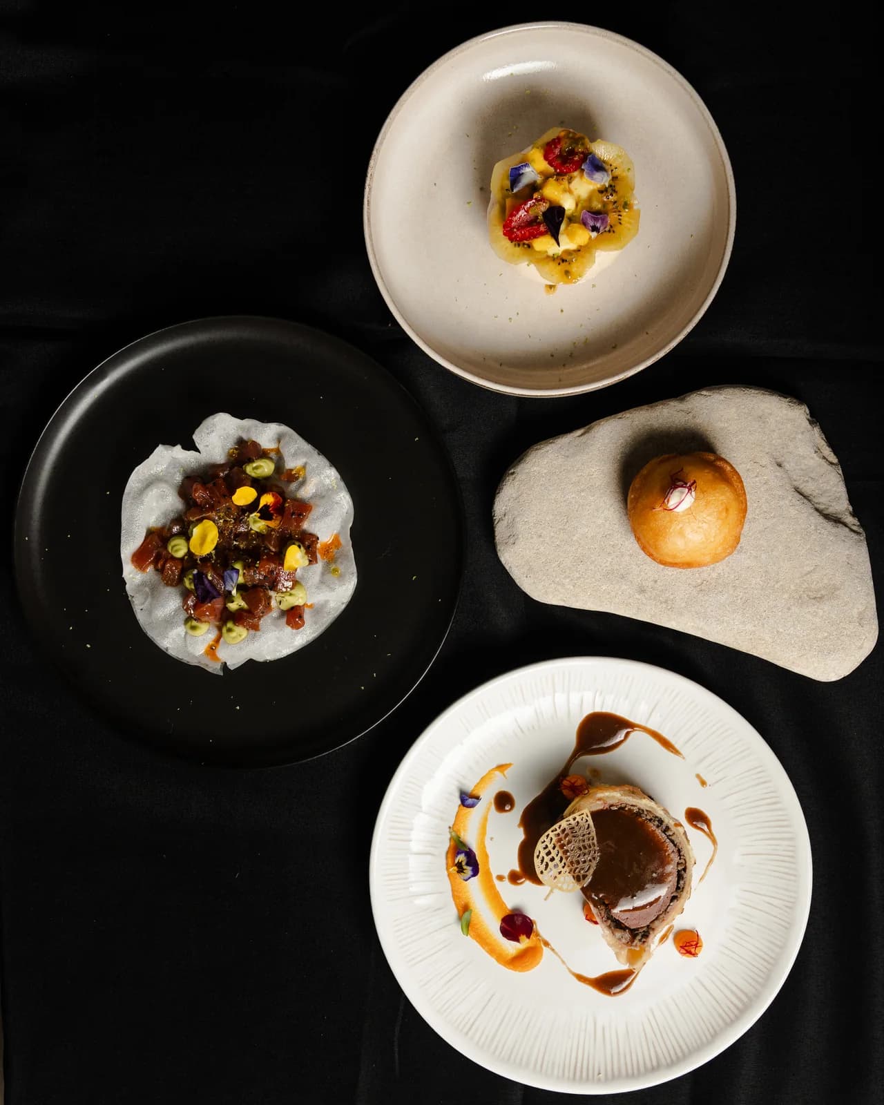 Selection of plated dishes prepared by chef Guillem Roig for a private dining service